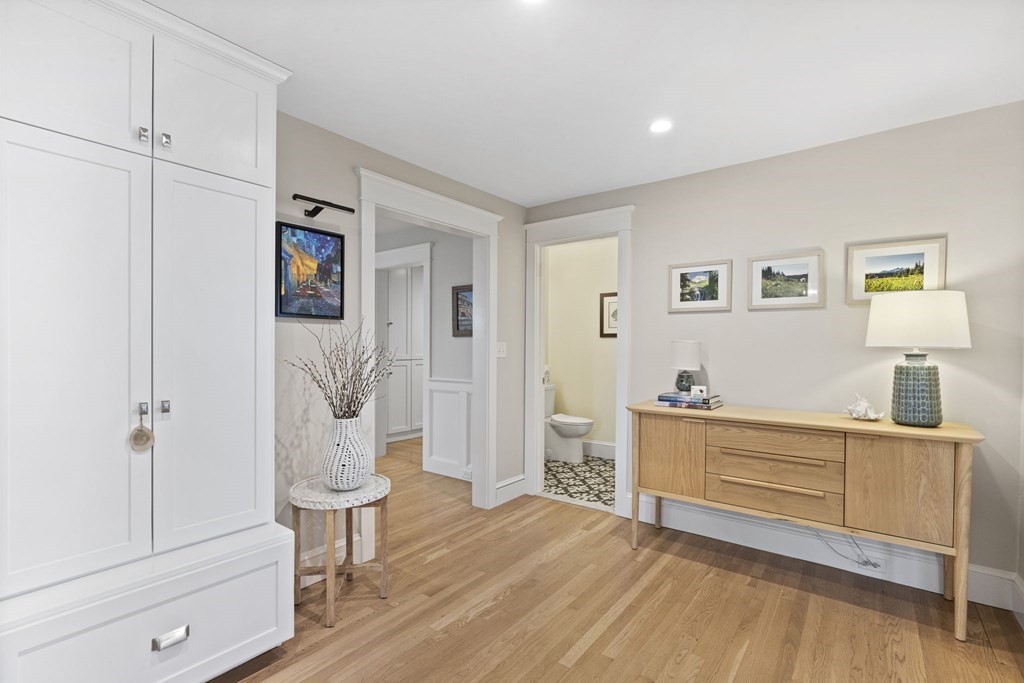 111 Mann Hill Road Scituate, MA 02066 - Photo 8 of 37 a view of a livingroom with wooden floor and cabinet