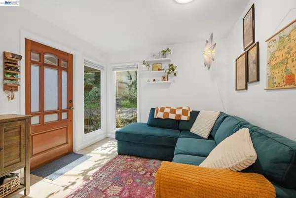 a living room with furniture and a rug