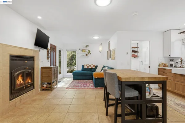 a kitchen with stainless steel appliances a stove refrigerator sink and microwave