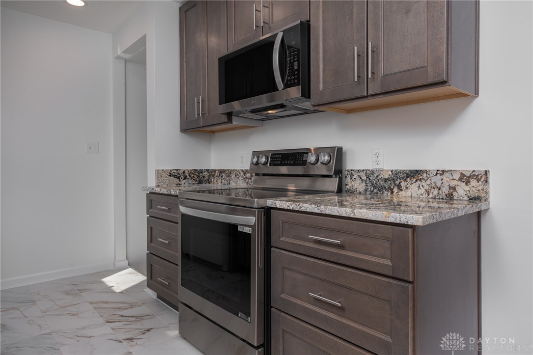 326 North Bromfield Road Kettering, OH 45429 - Photo 9 of 30 This modern kitchen features sleek appliances and elegant stone counters.