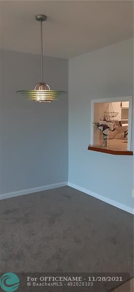 5800 Margate Boulevard Margate, FL 33063 - Photo 12 of 19 a view of a room with furniture and chandelier