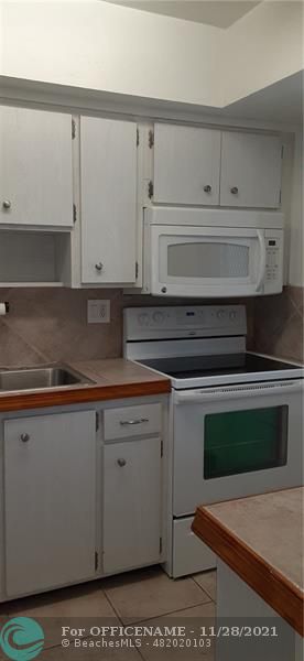 5800 Margate Boulevard Margate, FL 33063 - Photo 15 of 19 a view of cabinets and wooden cabinets