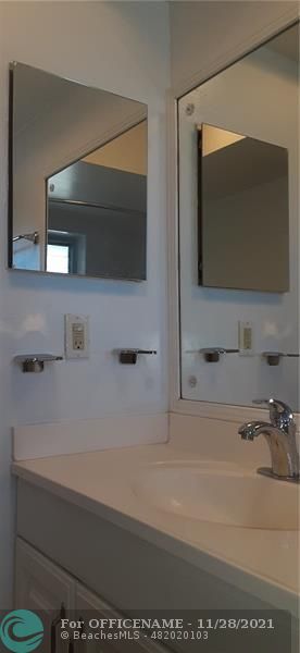 5800 Margate Boulevard Margate, FL 33063 - Photo 3 of 19 a bathroom with a bathtub and a mirror
