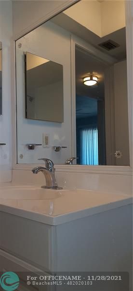 5800 Margate Boulevard Margate, FL 33063 - Photo 5 of 19 a bathroom with a sink and a mirror