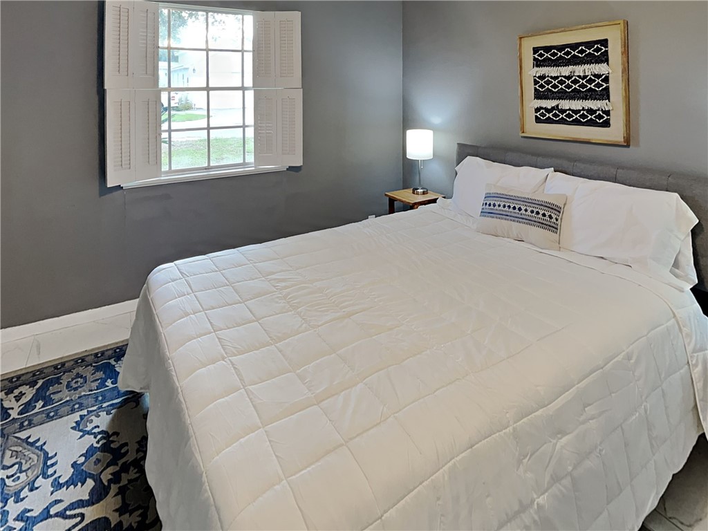 3554 Denver Avenue Corpus Christi, TX 78411 - Photo 16 of 21 a bedroom with a bed and a window