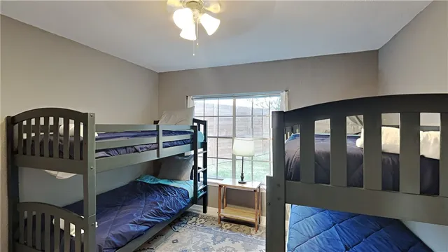 a bedroom with furniture and a window