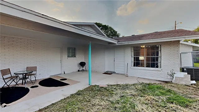a backyard of a house with seating space
