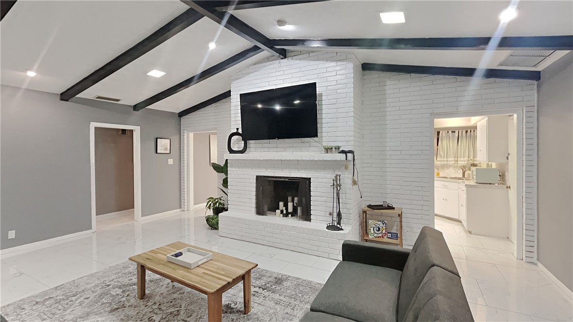 3554 Denver Avenue Corpus Christi, TX 78411 - Photo 7 of 21 a living room with furniture and a fireplace