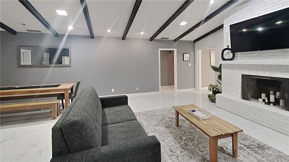 3554 Denver Avenue Corpus Christi, TX 78411 - Photo 8 of 21 a living room with furniture and a fireplace