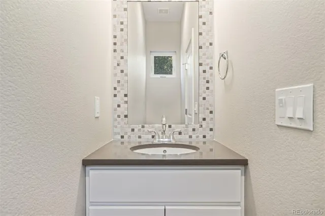 an empty room with a empty space and a ceiling fan