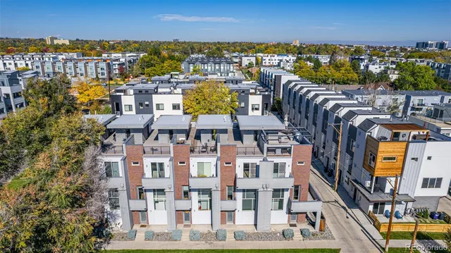 a view of a patio with swimming pool and sitting area