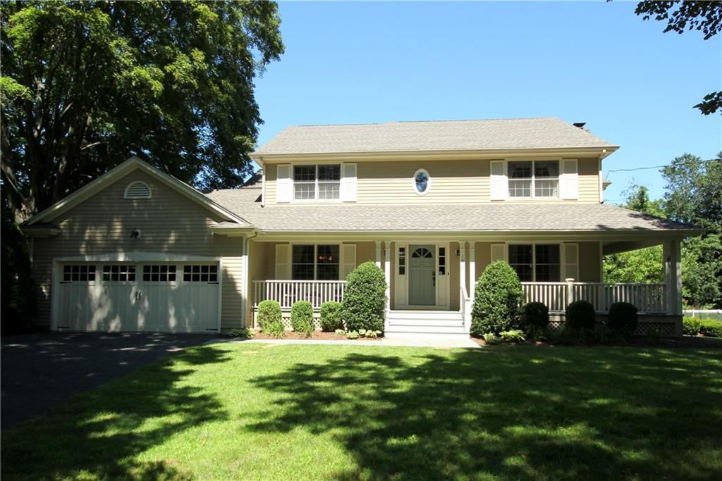 1060 Burroughs Road Fairfield, CT 06825 - Photo 1 of 1 a front view of a house with a yard