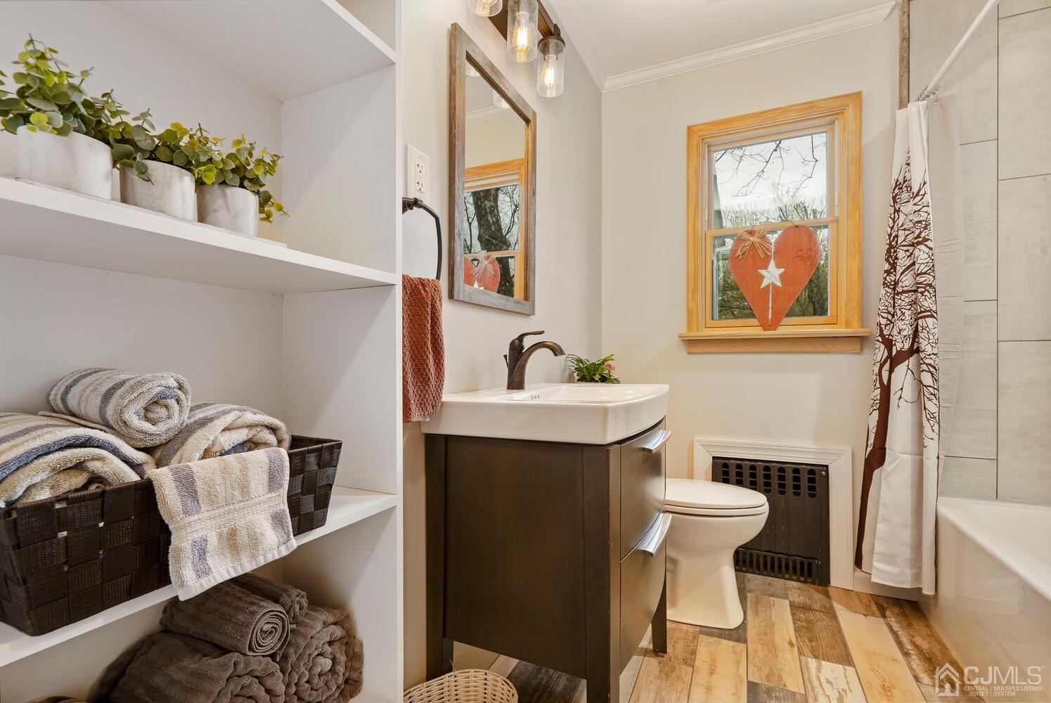 48 Lancaster Road Colonia, NJ 07067 - Photo 12 of 37 a bathroom with a sink and a mirror