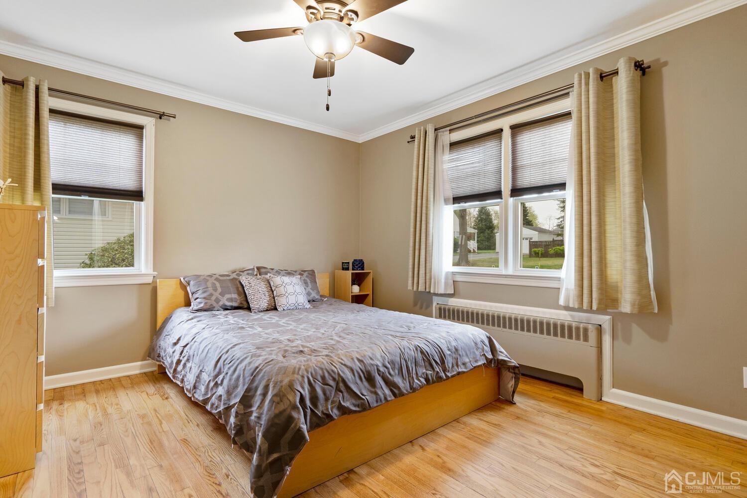 48 Lancaster Road Colonia, NJ 07067 - Photo 16 of 37 a bedroom with a large bed and a window