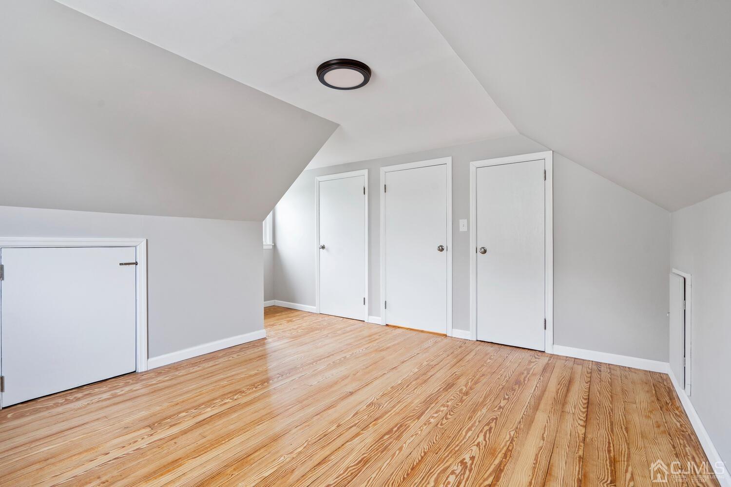 48 Lancaster Road Colonia, NJ 07067 - Photo 19 of 37 a view of an empty room with wooden floor