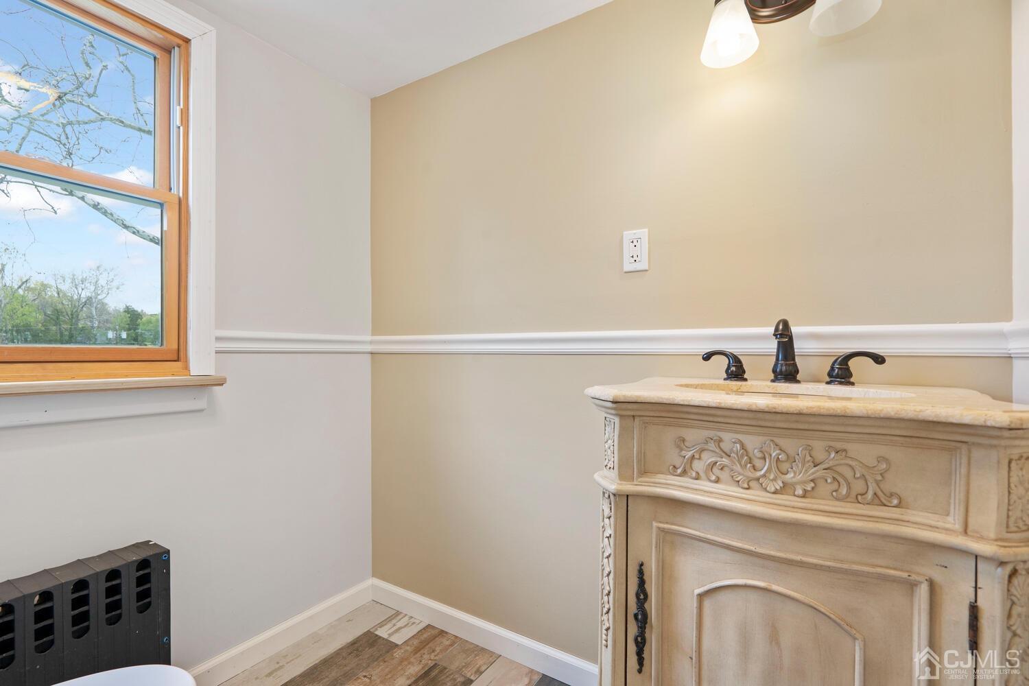48 Lancaster Road Colonia, NJ 07067 - Photo 20 of 37 a view of a utility room with a sink