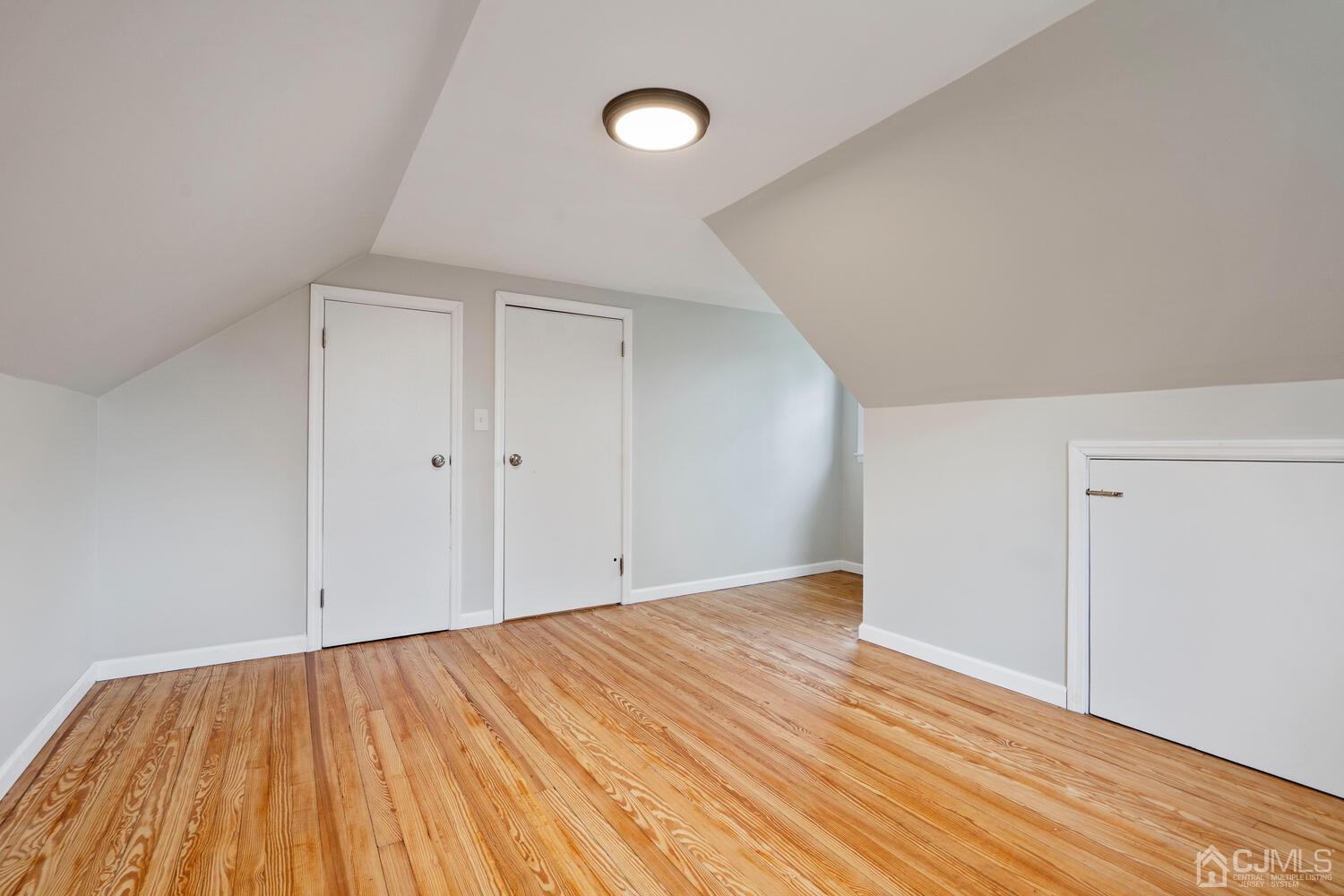 48 Lancaster Road Colonia, NJ 07067 - Photo 22 of 37 a view of empty room with wooden floor