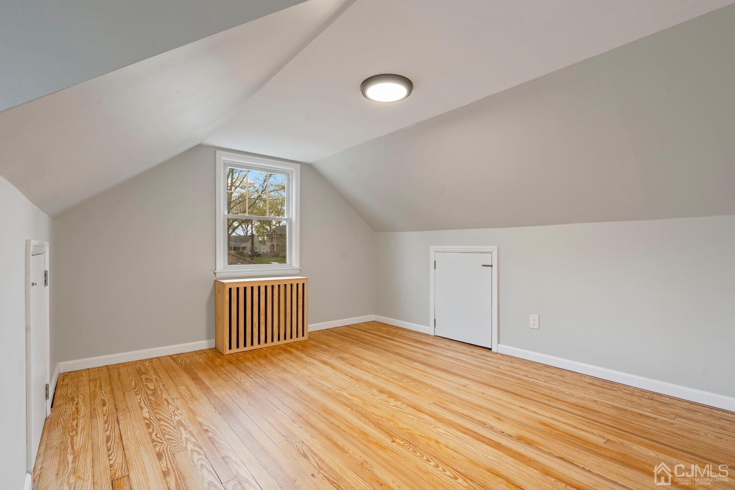 48 Lancaster Road Colonia, NJ 07067 - Photo 23 of 37 wooden floor in an empty room