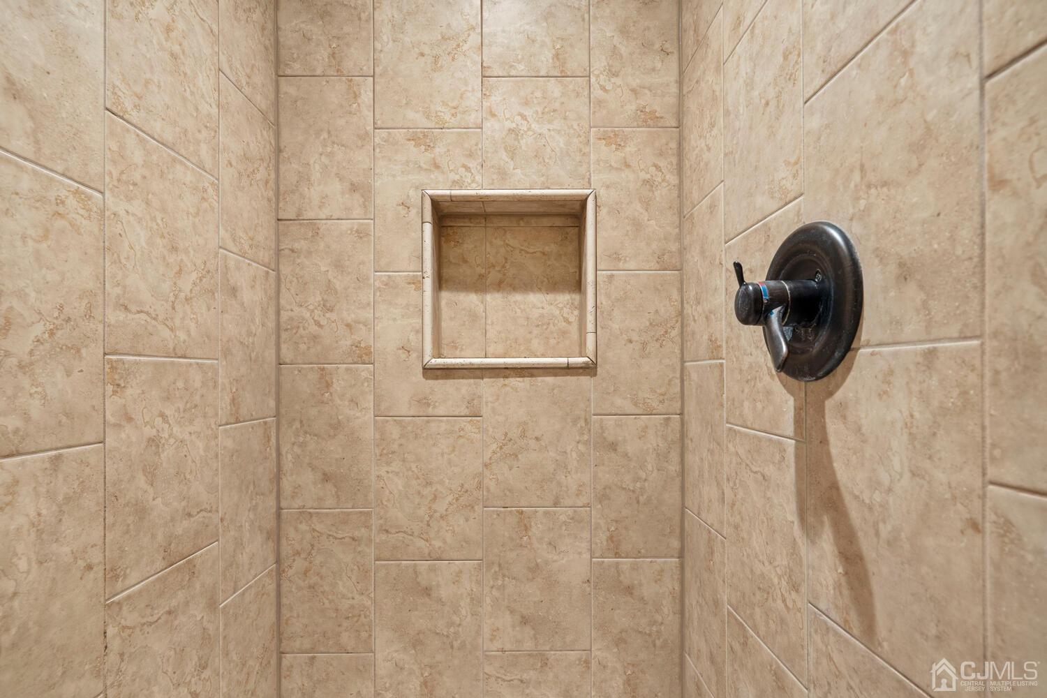 48 Lancaster Road Colonia, NJ 07067 - Photo 25 of 37 a bathroom with a sink and a shower