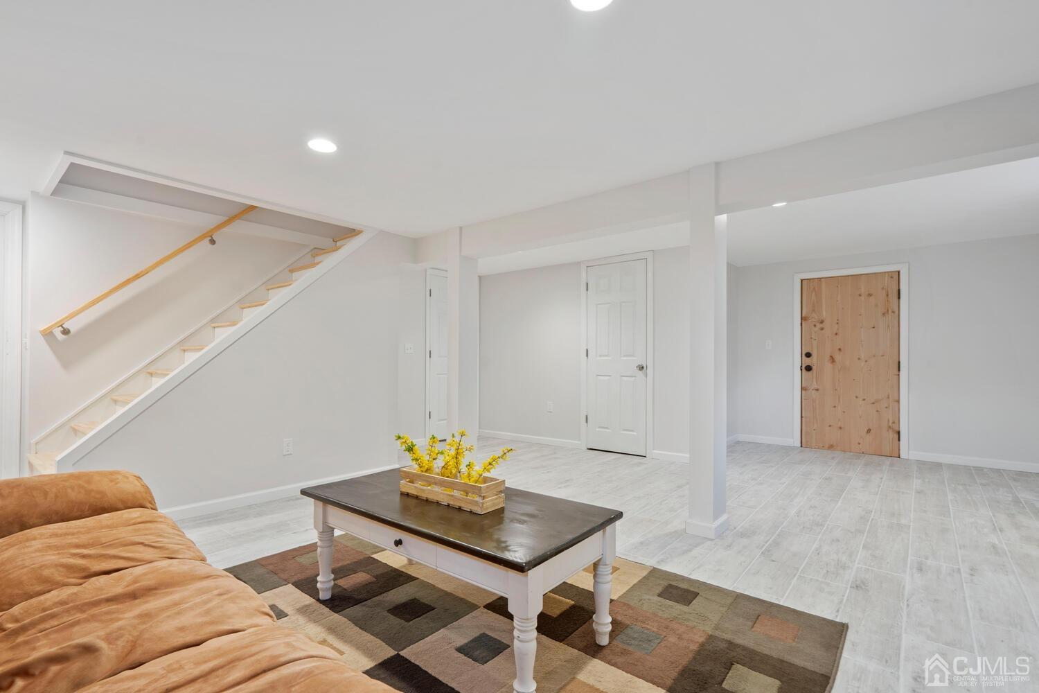 48 Lancaster Road Colonia, NJ 07067 - Photo 26 of 37 a living room with furniture and with wooden floor