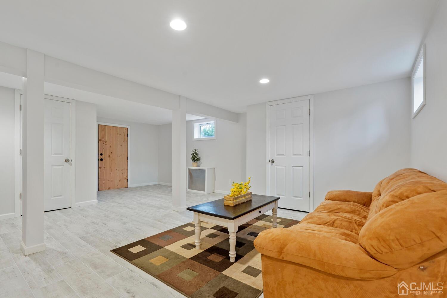 48 Lancaster Road Colonia, NJ 07067 - Photo 29 of 37 a living room with furniture and wooden floor