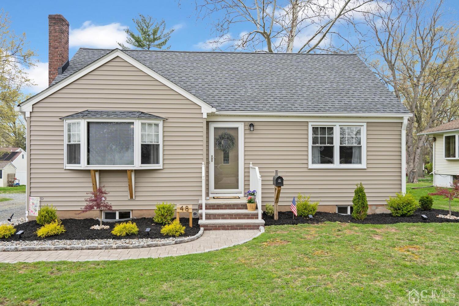 48 Lancaster Road Colonia, NJ 07067 - Photo 30 of 37 a view of a house with a yard and sitting area