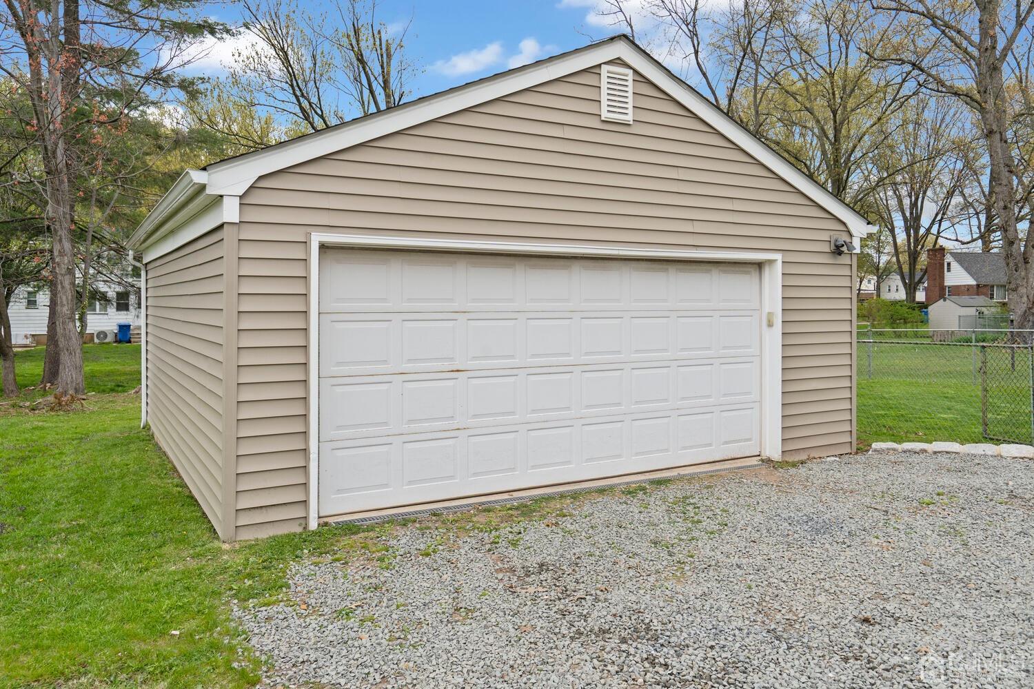 48 Lancaster Road Colonia, NJ 07067 - Photo 33 of 37 a front view of a house with a yard