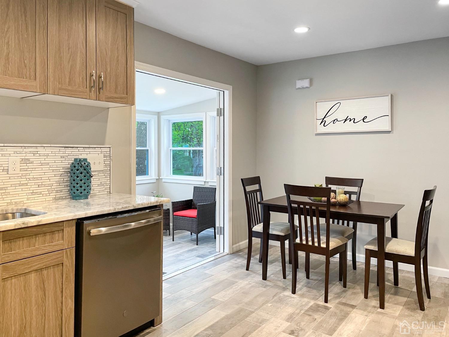 48 Lancaster Road Colonia, NJ 07067 - Photo 4 of 37 a view of a dining room with furniture and wooden floor