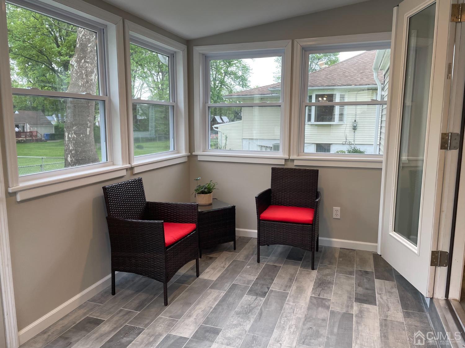 48 Lancaster Road Colonia, NJ 07067 - Photo 5 of 37 a living room with furniture and a large window