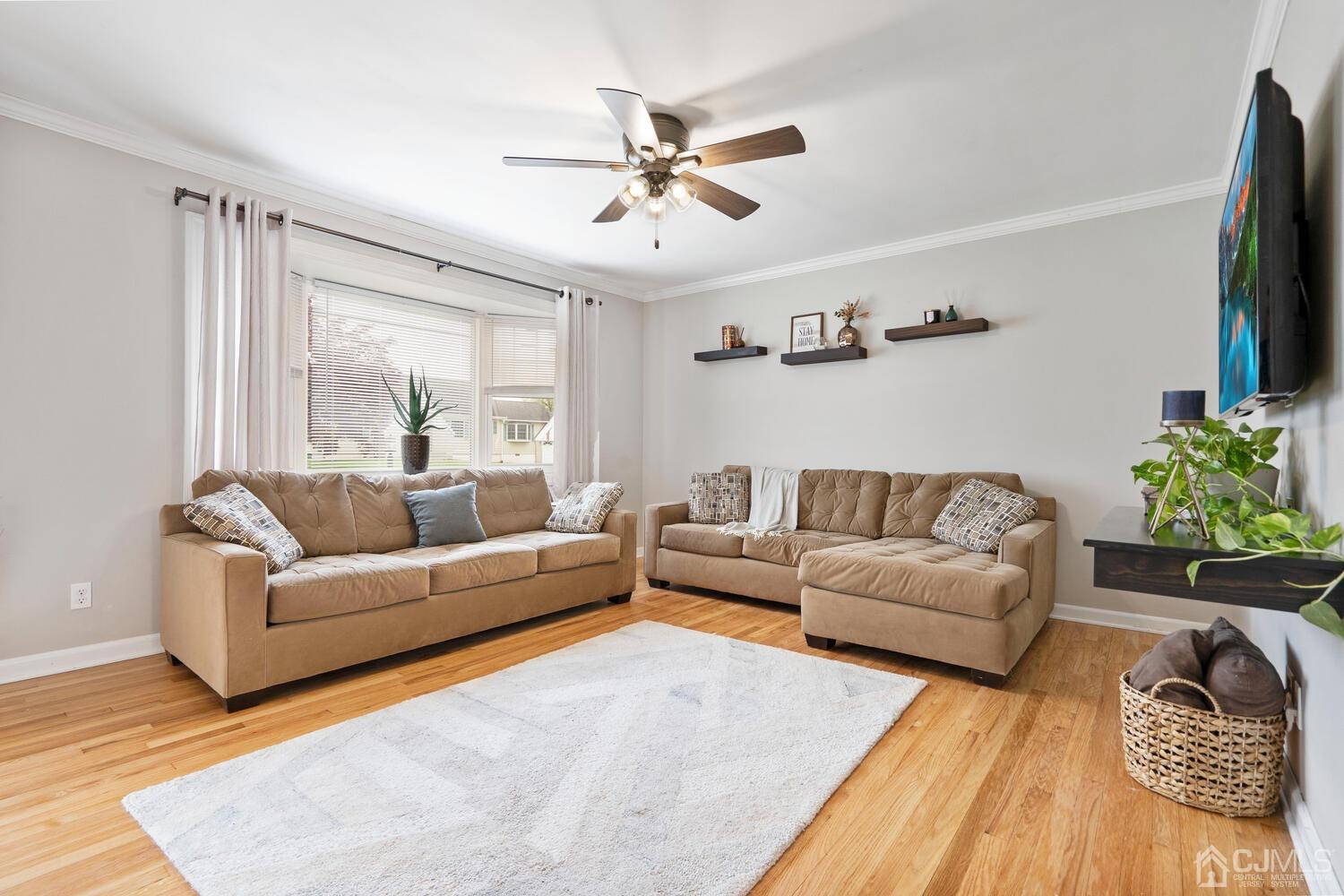 48 Lancaster Road Colonia, NJ 07067 - Photo 7 of 37 a living room with furniture and a flat screen tv