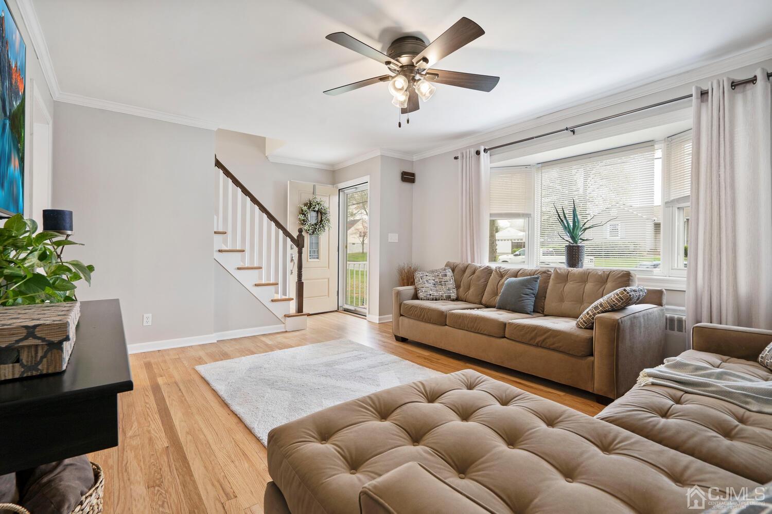 48 Lancaster Road Colonia, NJ 07067 - Photo 8 of 37 a living room with furniture and a large window