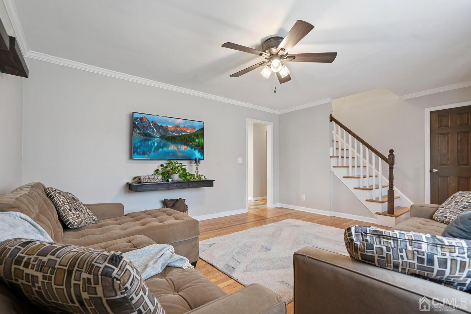 48 Lancaster Road Colonia, NJ 07067 - Photo 9 of 37 a living room with furniture and a window