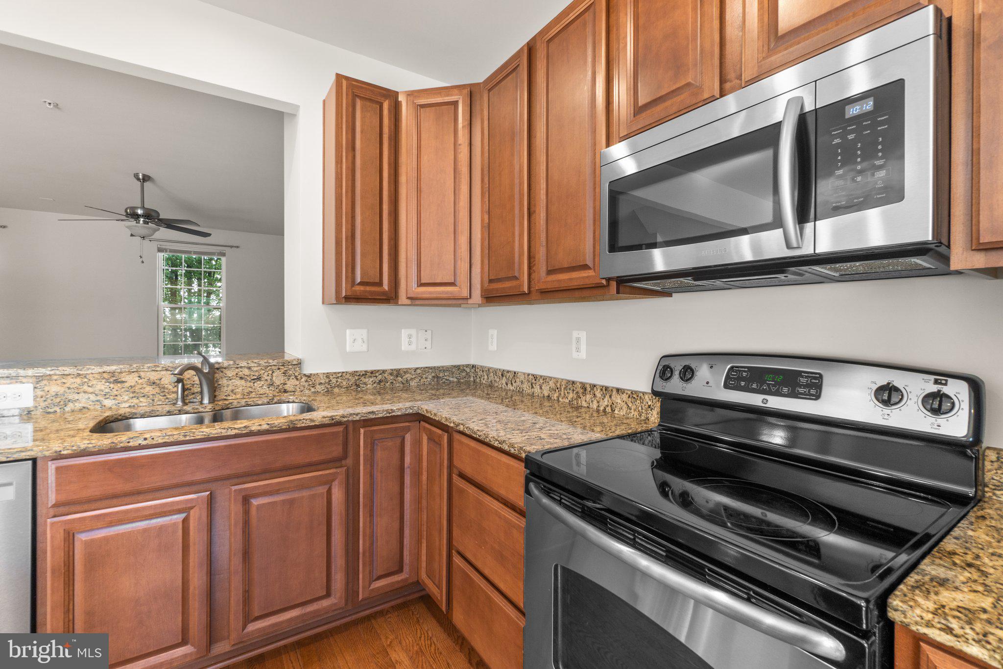 2061 Spring Run Circle Frederick, MD 21702 - Photo 15 of 42 a kitchen with a stove microwave and sink