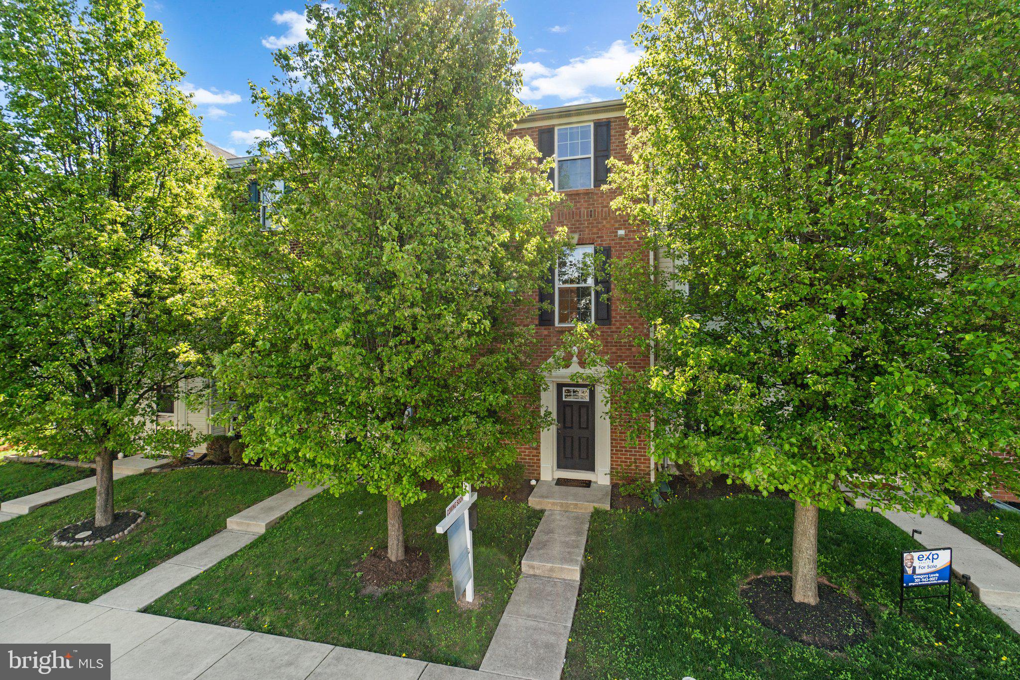 2061 Spring Run Circle Frederick, MD 21702 - Photo 2 of 42 a front view of a house with garden