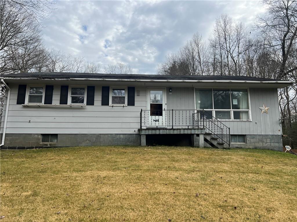 View of front of property with a front lawn