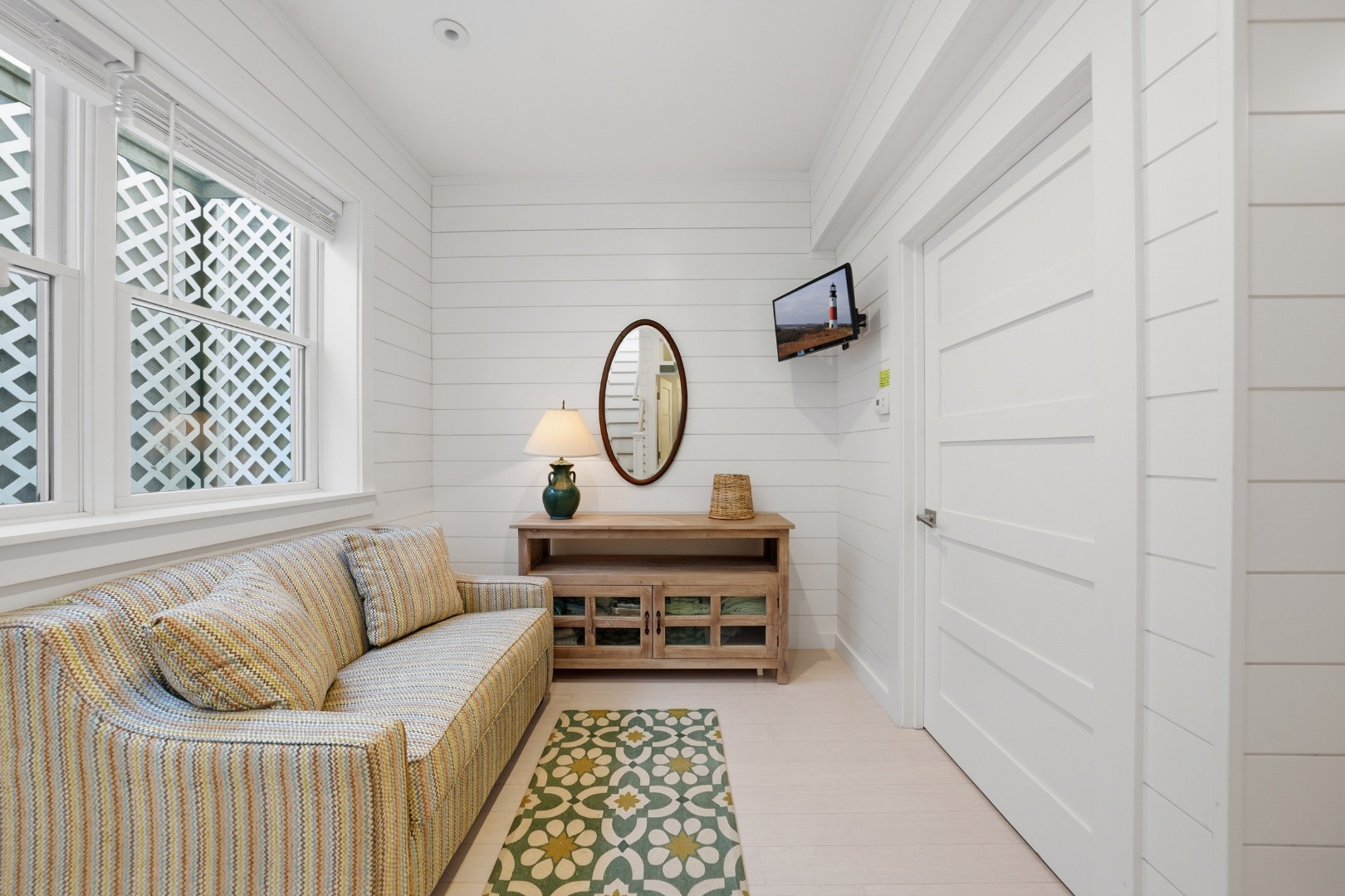 10 Pilgrim Road Nantucket, MA 02554 - Photo 47 of 65 a living room with furniture a rug and a window