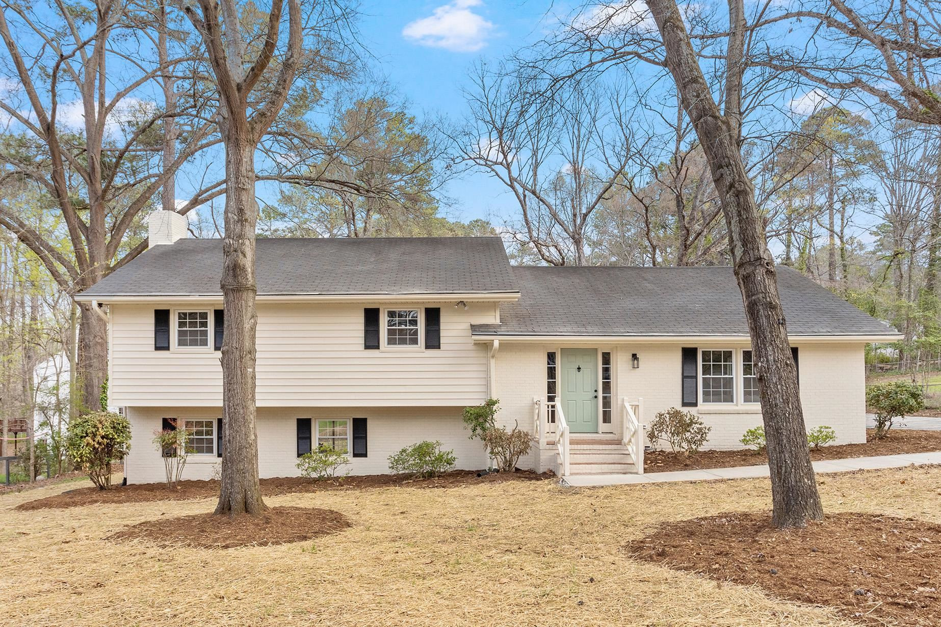 2906 Buckingham Road Durham, NC 27707 - Photo 1 of 34 a front view of a house with a tree in front