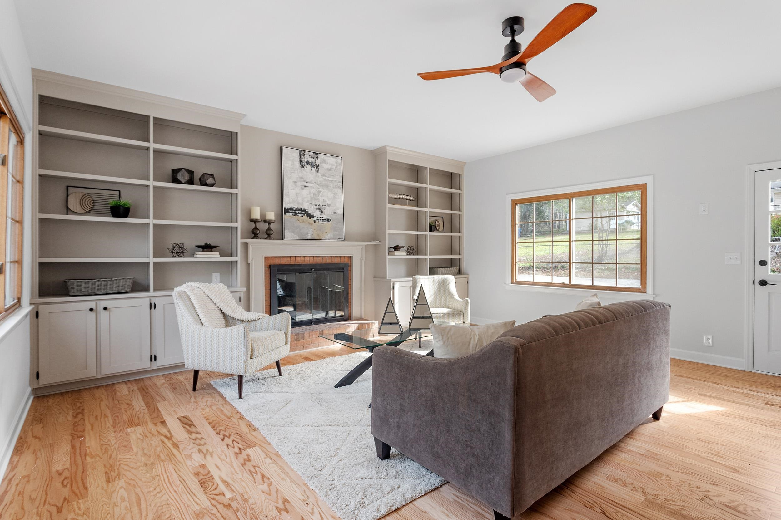 2906 Buckingham Road Durham, NC 27707 - Photo 13 of 34 a living room with furniture and a fireplace