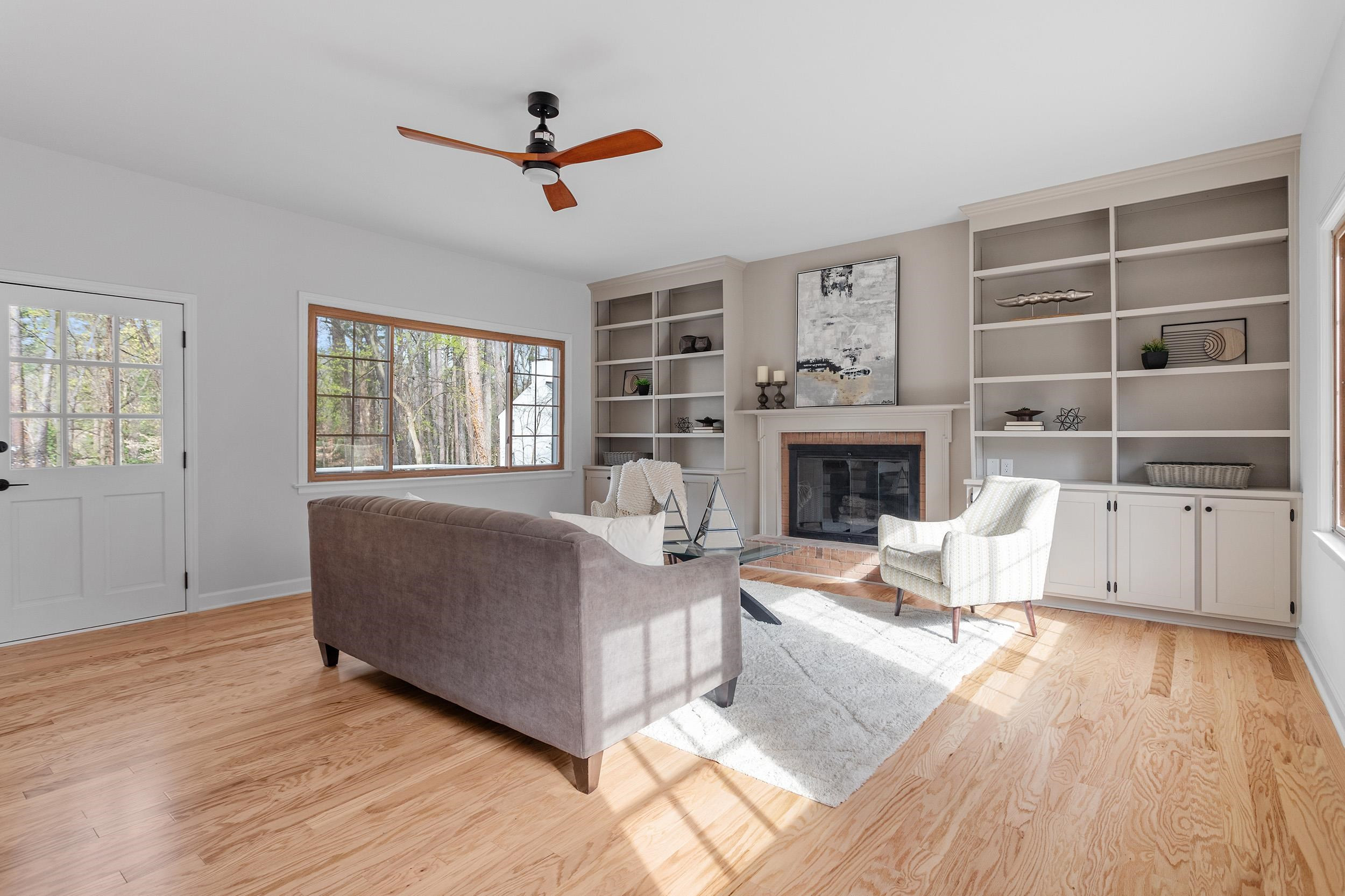 2906 Buckingham Road Durham, NC 27707 - Photo 14 of 34 a living room with furniture and a fireplace