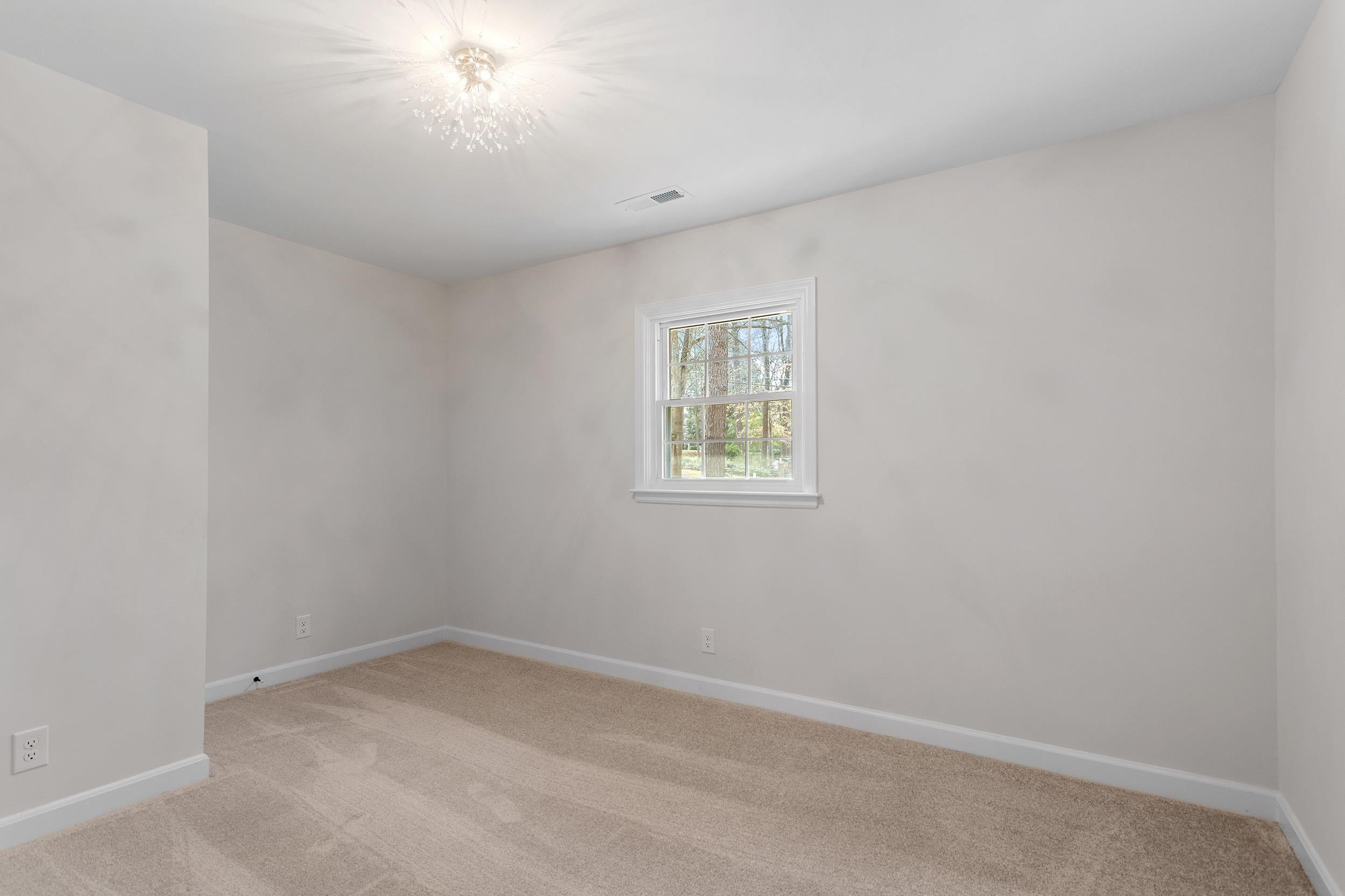 2906 Buckingham Road Durham, NC 27707 - Photo 20 of 34 an empty room with a window