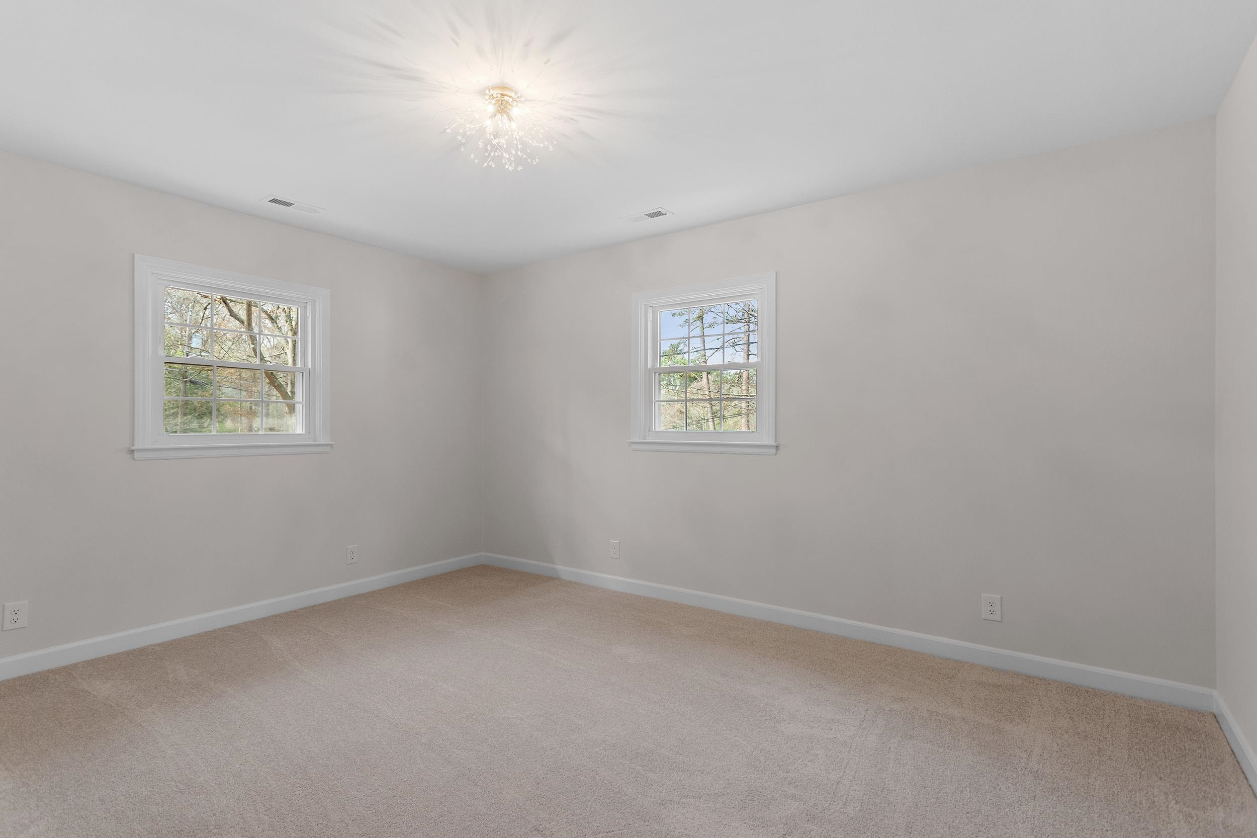 2906 Buckingham Road Durham, NC 27707 - Photo 21 of 34 an empty room with a window