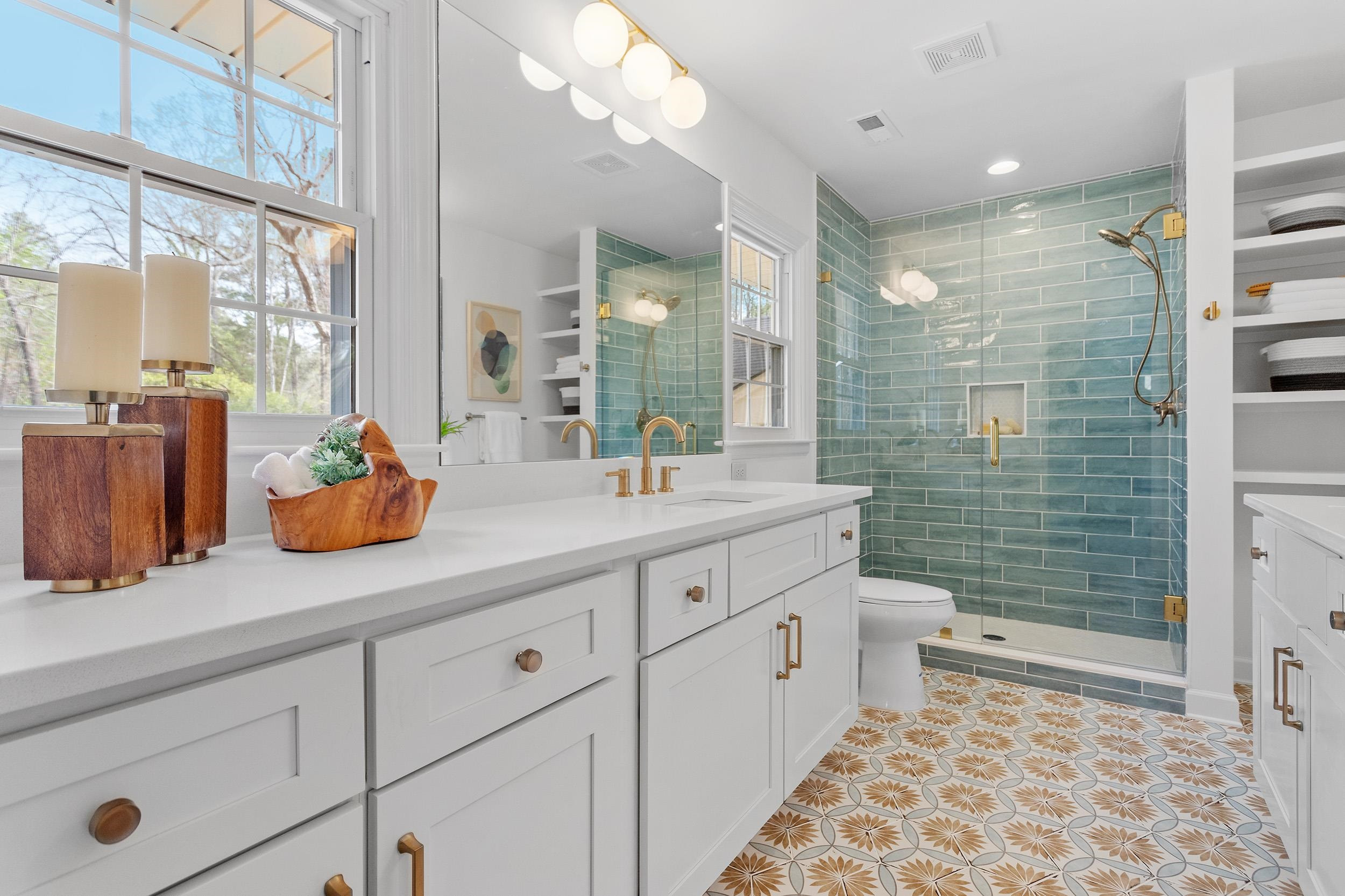 2906 Buckingham Road Durham, NC 27707 - Photo 24 of 34 a bathroom with a double vanity sink toilet and shower