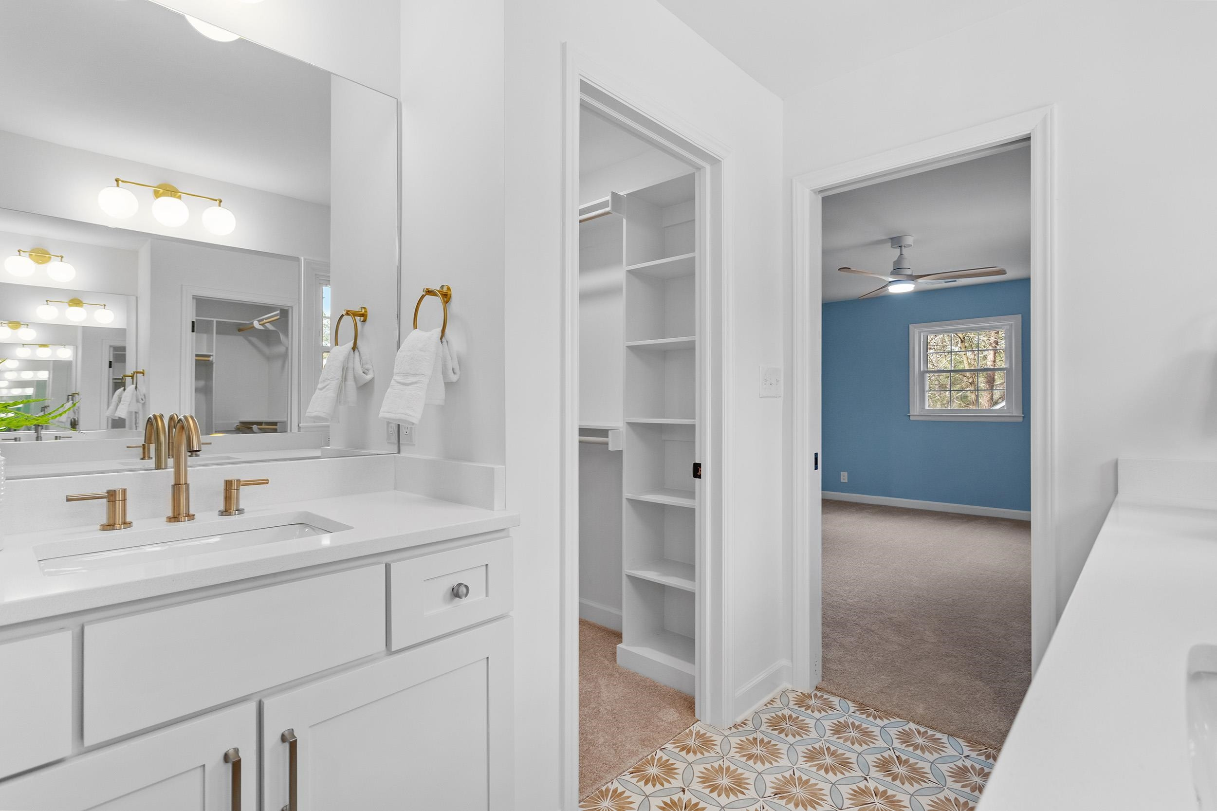 2906 Buckingham Road Durham, NC 27707 - Photo 25 of 34 a en suite bathroom with a granite countertop sink and a mirror