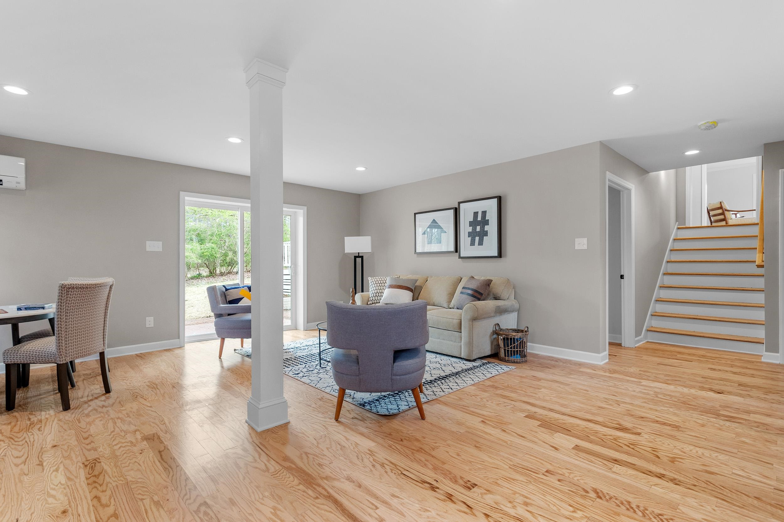 2906 Buckingham Road Durham, NC 27707 - Photo 27 of 34 a living room with furniture and a wooden floor