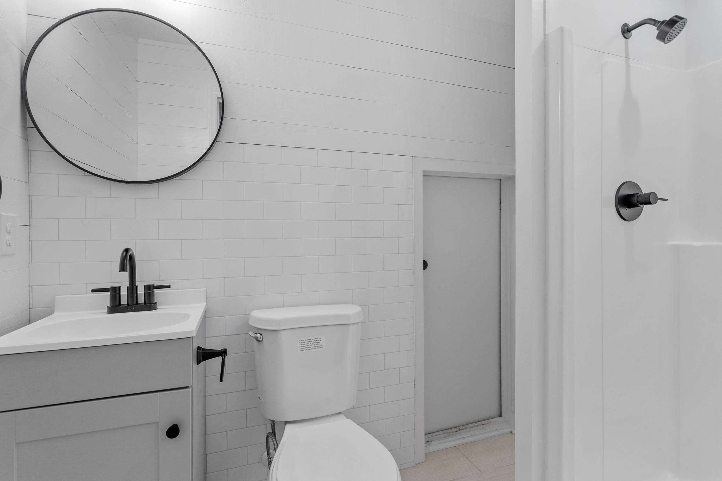 2906 Buckingham Road Durham, NC 27707 - Photo 29 of 34 a bathroom with a toilet and a sink