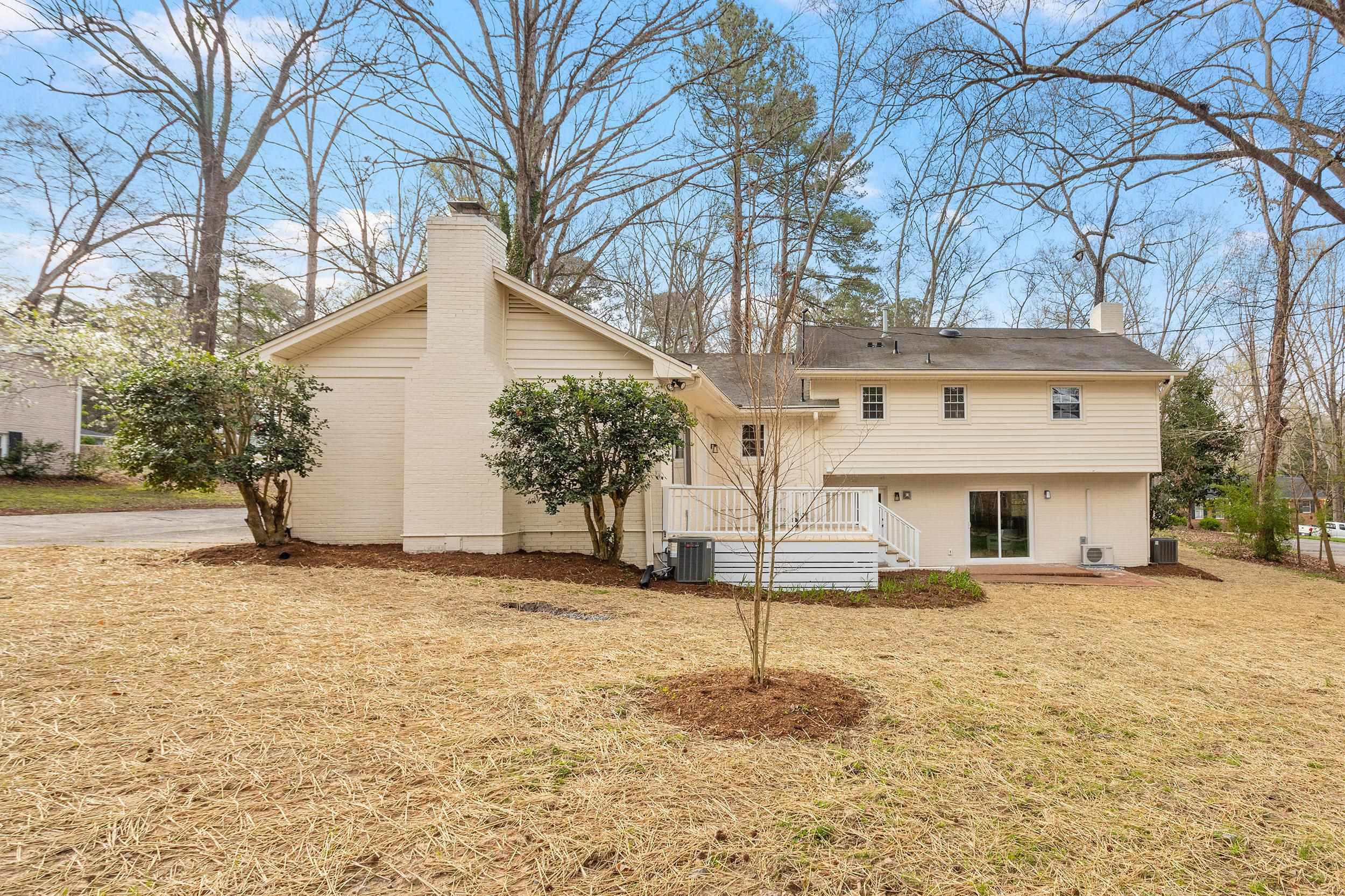 2906 Buckingham Road Durham, NC 27707 - Photo 30 of 34 a front view of a house with a yard and garage