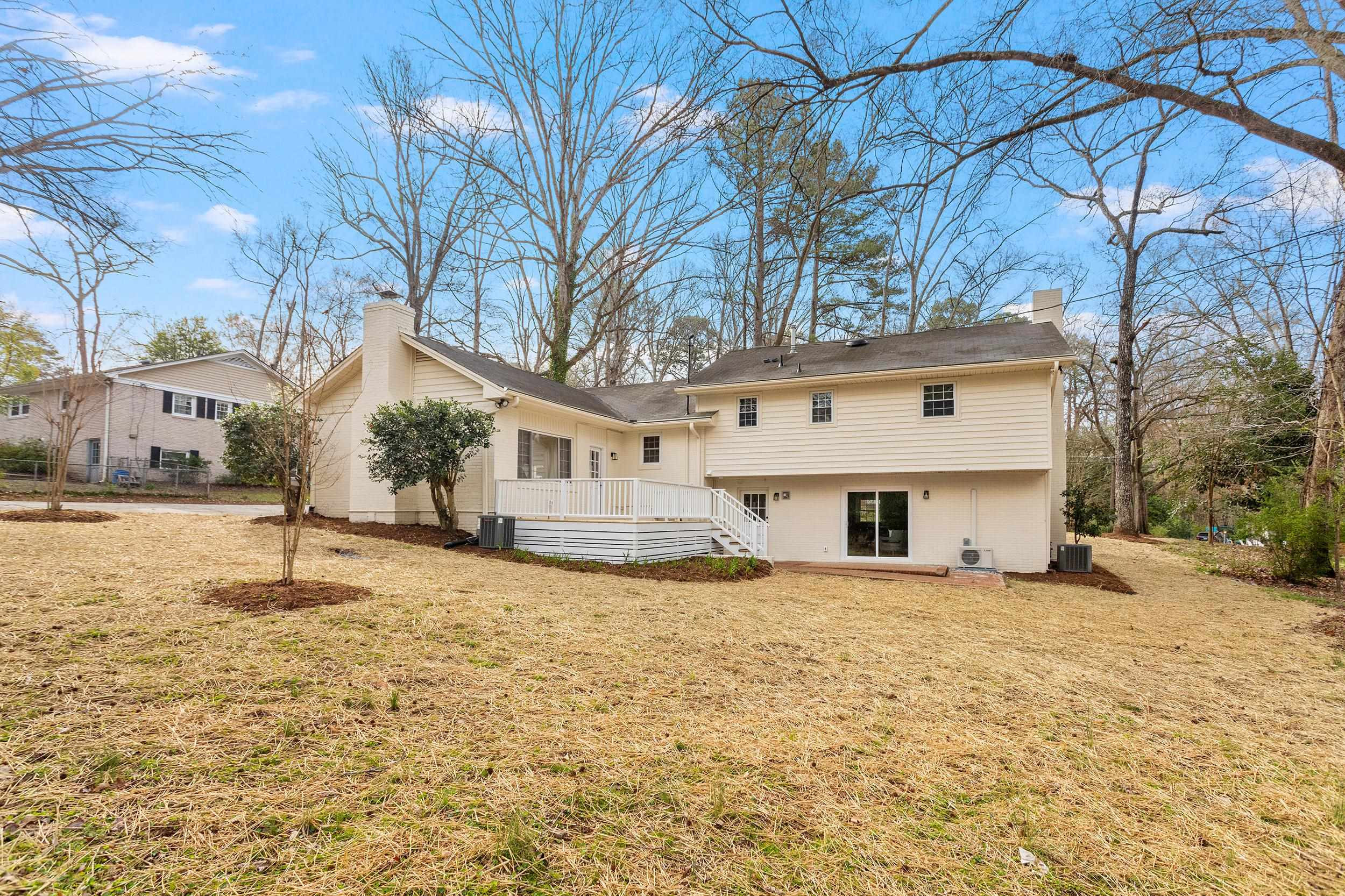 2906 Buckingham Road Durham, NC 27707 - Photo 31 of 34 a white house with a large tree in front of it