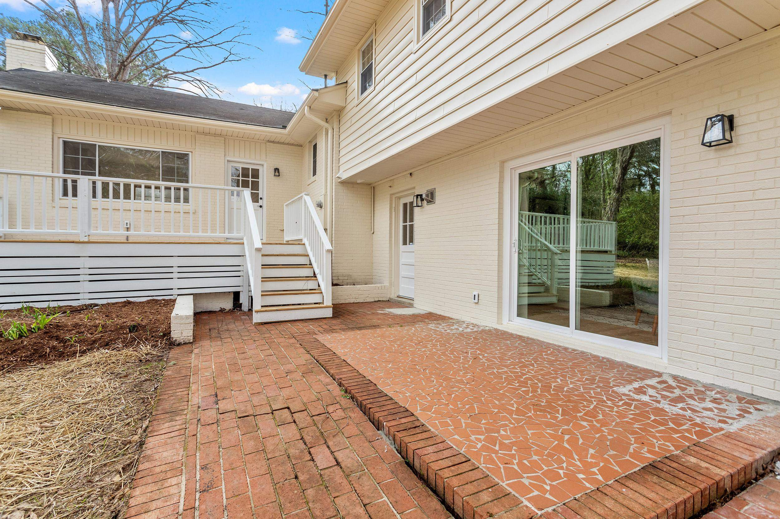 2906 Buckingham Road Durham, NC 27707 - Photo 33 of 34 a view of a backyard with stairs and a chair