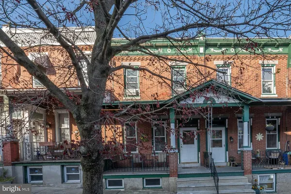 a view of a building with a tree