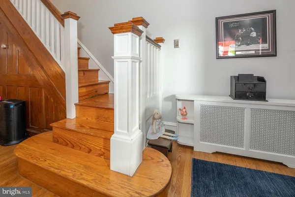 a view of a livingroom with furniture and staircase